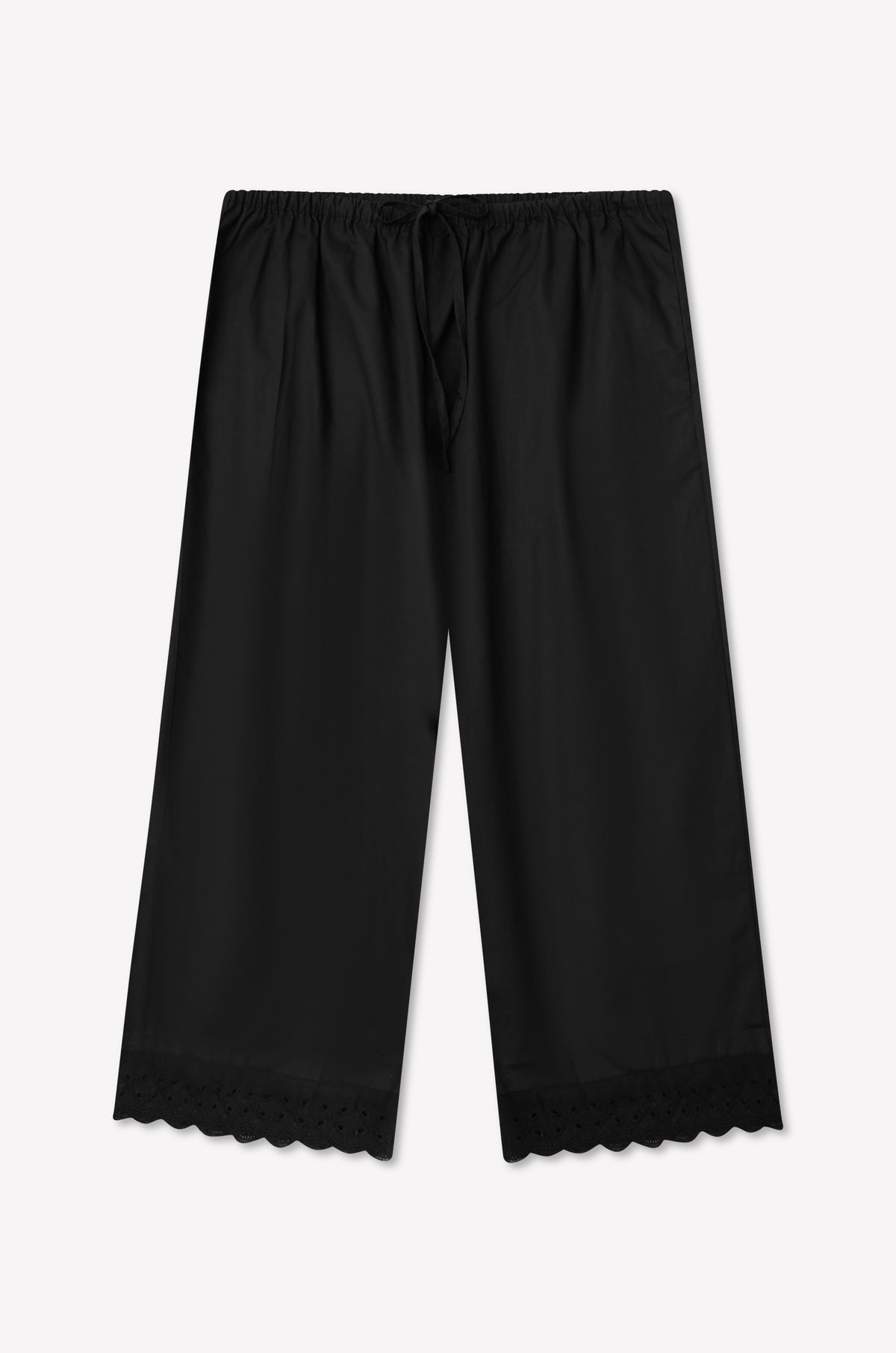 Ellery Capri - Black wide-leg relaxed fit pants by 0, featuring an elastic waistband with drawstring and broderie anglaise scalloped lace trim at the hem. The pants are laid flat against a white background.