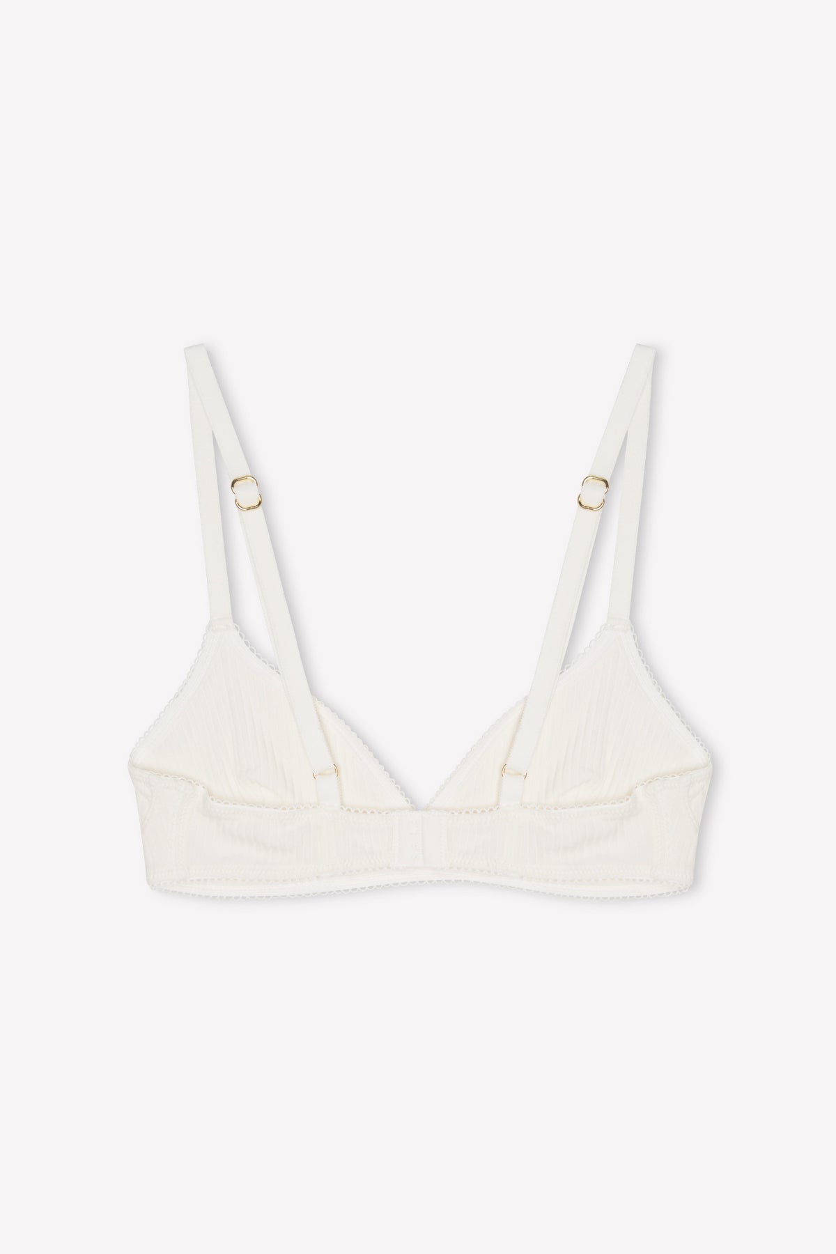 The Sophia Soft Tri - Pumice from 0 is a white triangle bralette with adjustable straps and gold hardware, offering medium coverage, shown on a plain white background.