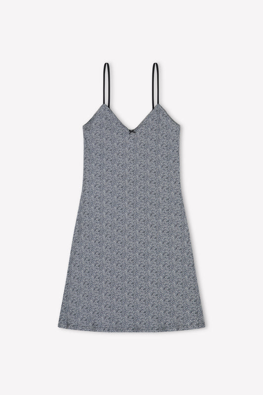 The Lola Mini Dress in Midnight Floral by Juem on a white background.