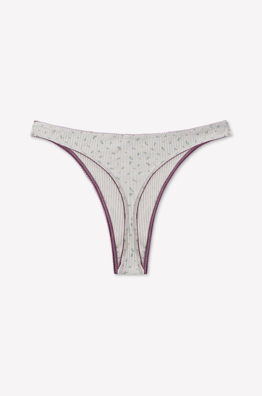 The Bonnie G String - Blue Floral by 0 features a striped, light-colored design with small floral patterns, purple trim, and scalloped edge detailing. It is displayed on a plain white background.