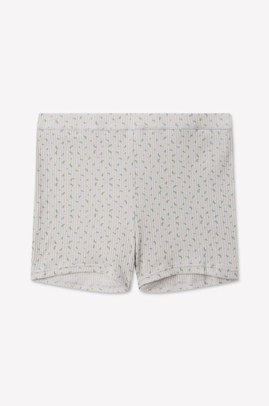 Maggie Short - Blue Floral by 0, featuring a white fitted, mid-rise silhouette with a delicate vertical blue floral pattern, crafted from soft organic cotton and laid flat on a white background.