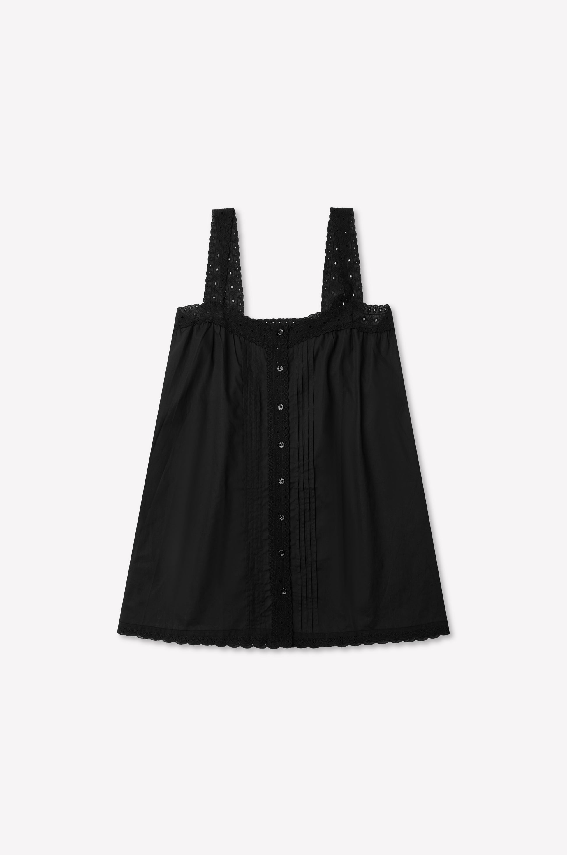Ottie Dress - Black by 0, featuring wide broderie anglaise eyelet straps, a sleeveless design, front button closure, pleated detailing, and a scalloped hem, laid flat on a white background.