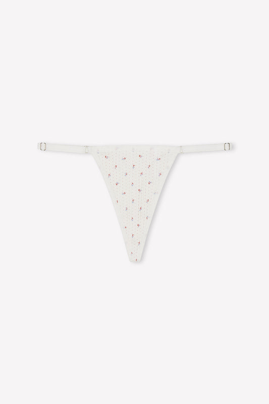 The Harri Brief - Flora is a white ribbed G-string thong with a subtle floral pattern, adjustable thin side straps, and stretch cotton fabric, shown on a plain white background.