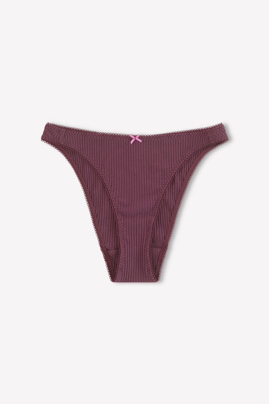 The Lera Brief - Plum by 0 is a pair of ribbed, dark mauve cotton briefs with cheeky coverage and a pink bow at the waistband, shown flat on a light background.