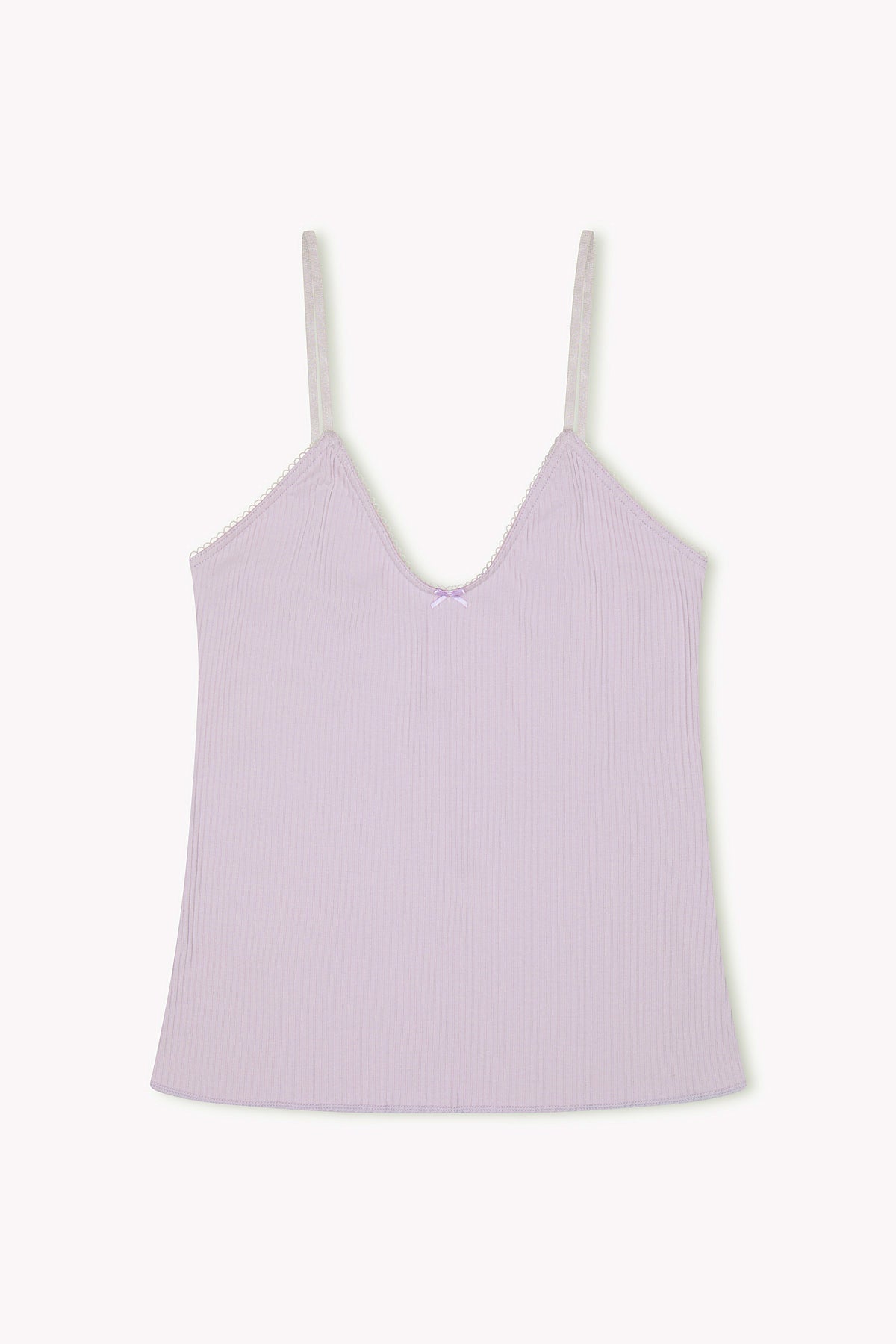 The Margot Tank - Iris is a light purple ribbed jersey top made from organic cotton, featuring thin adjustable straps and a small bow at the neckline, shown laid flat on a plain white background.