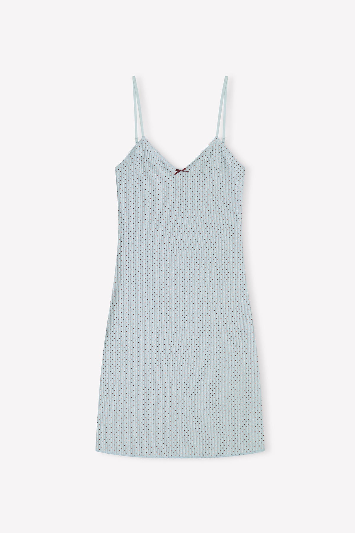 The Lola Mini Dress - Polka by 0 is a light blue, slip-style mini dress with thin adjustable straps and a subtle geometric dot pattern, shown laid flat on a white background.