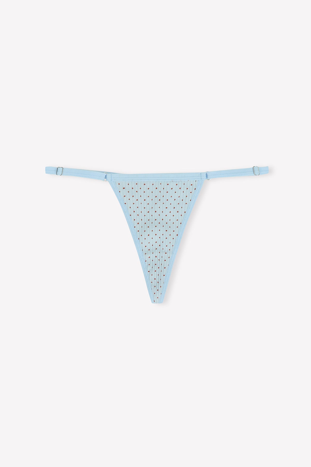 The Harri G String - Polka by 0 is a light blue thong with thin adjustable side straps and a sheer, rhinestone-detailed front, shown against a plain white background.