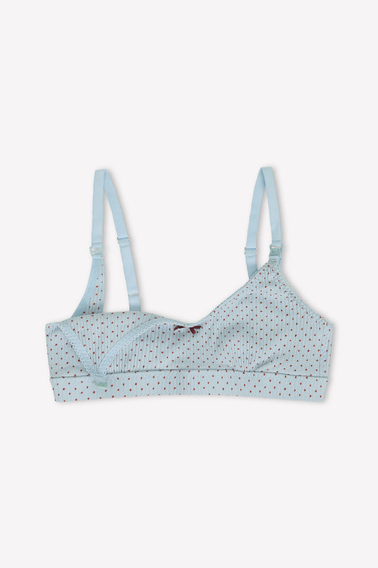 The Jane Maternity Crop - Polka by 0 is a light blue organic cotton maternity bra with red polka dots, adjustable straps, easy-open clasp, and a comfortable scoop neck. Shown on a plain white background.