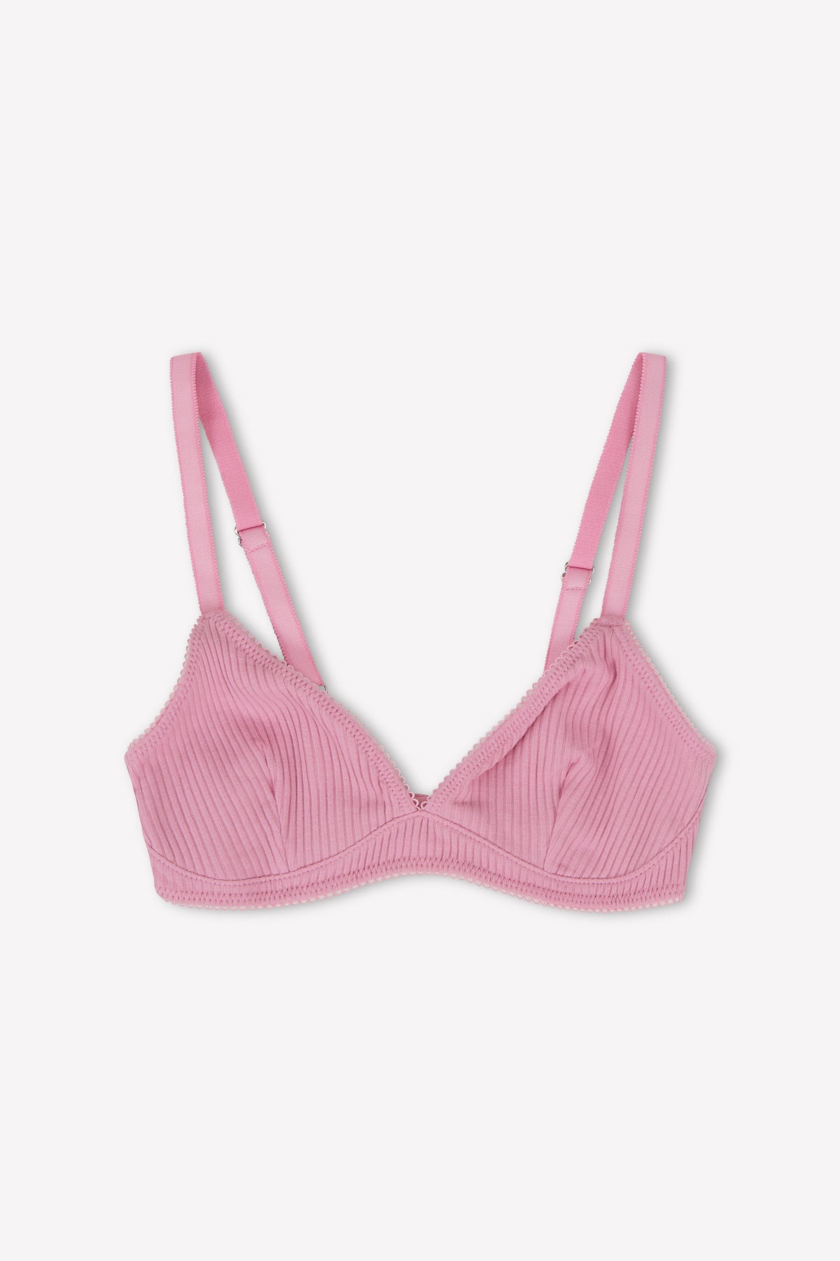 The Sophia Soft Tri - Fuchsia by 0 is a pink ribbed triangle bra with adjustable straps and scalloped trim, providing medium coverage, shown on a white background.