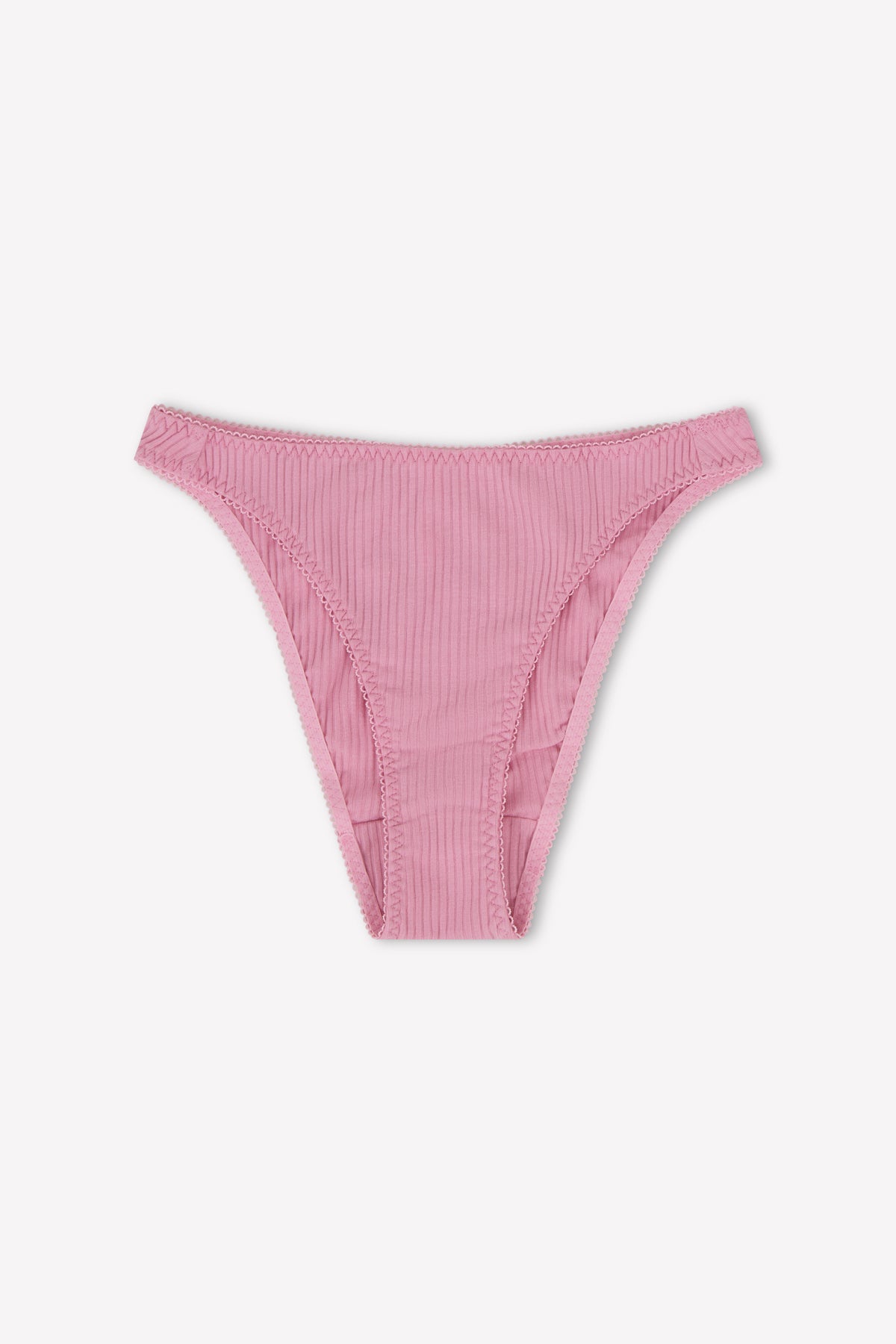 The Lera Brief by 0 is a pair of fuchsia ribbed cotton bikini-style underwear in a high-cut fit, shown laid flat on a white background.