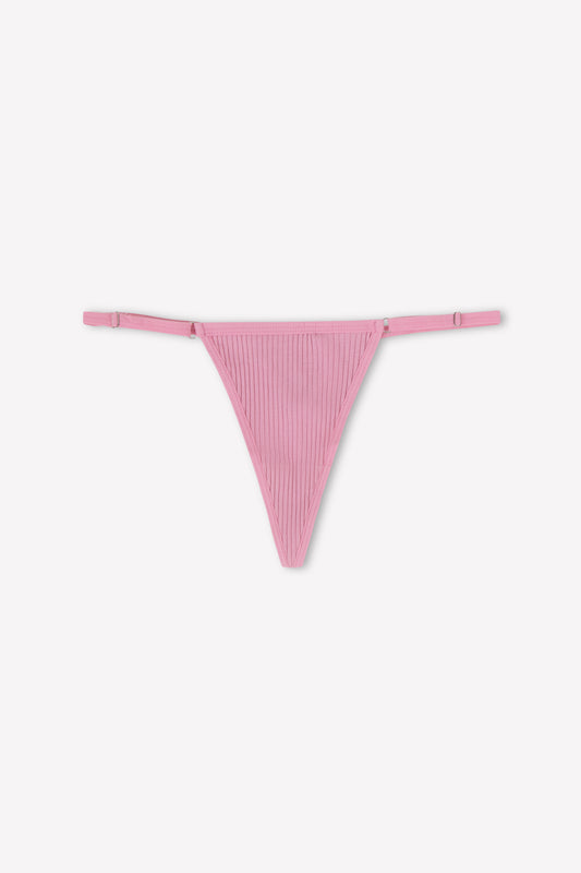 The Harri G String - Fuchsia by 0 is a pink ribbed stretch cotton thong with adjustable sides, shown on a plain white background.