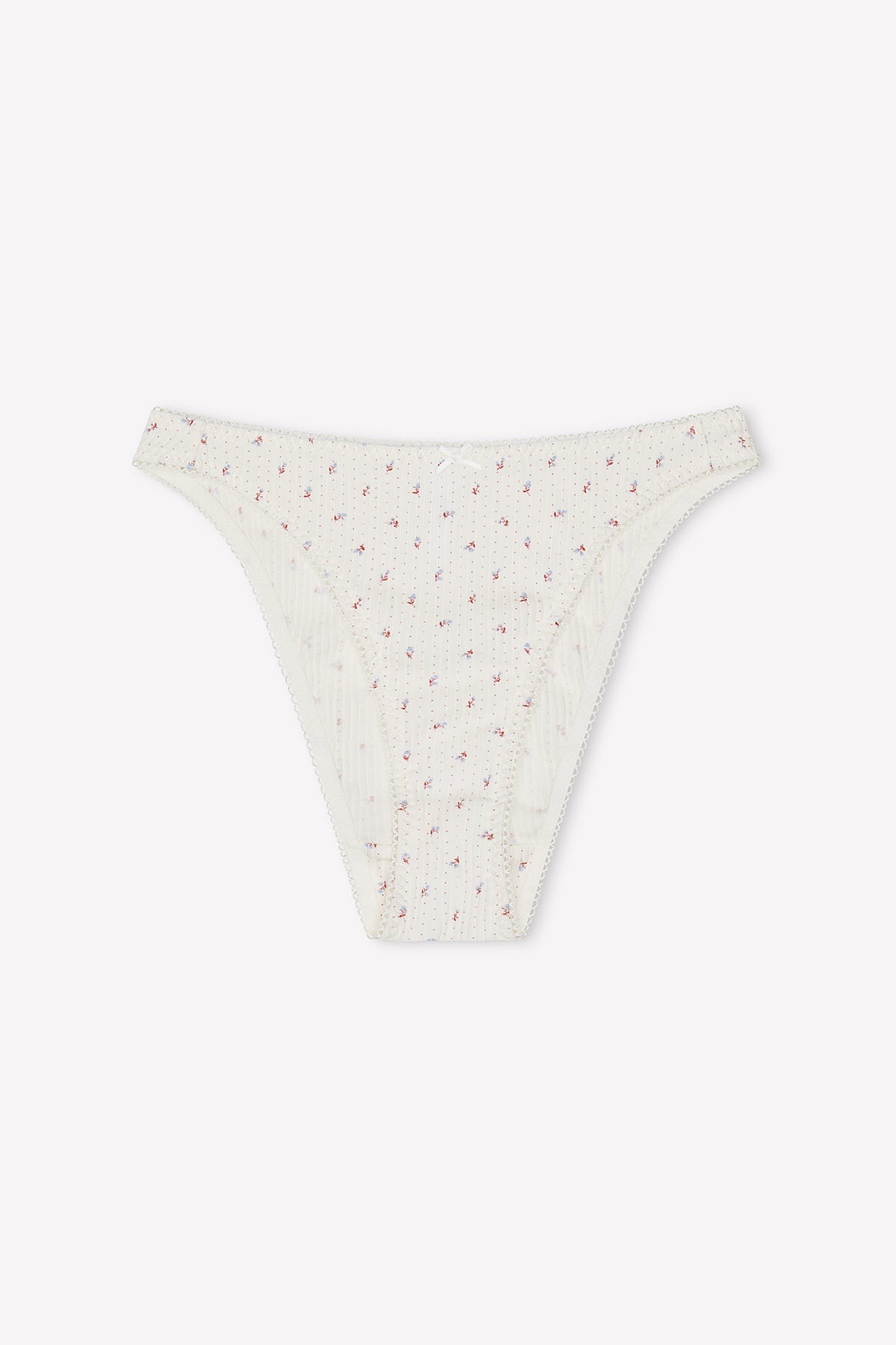 Lera Brief - Flora: White ribbed bikini-style underwear with a subtle floral dot print, crafted from soft cotton. Features a feminine design and flattering high-cut fit inspired by 90’s briefs, shown flat on a plain white background.